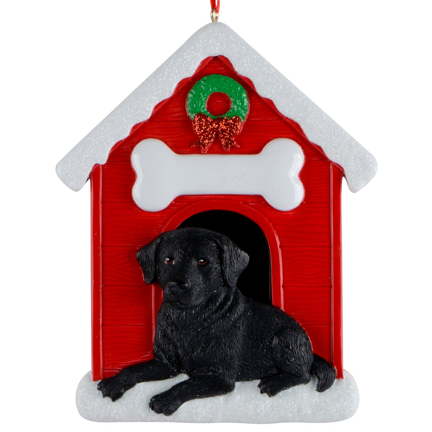 Handpainted black Labrador resting at doghouse entrance with red doghouse and green wreath ornament