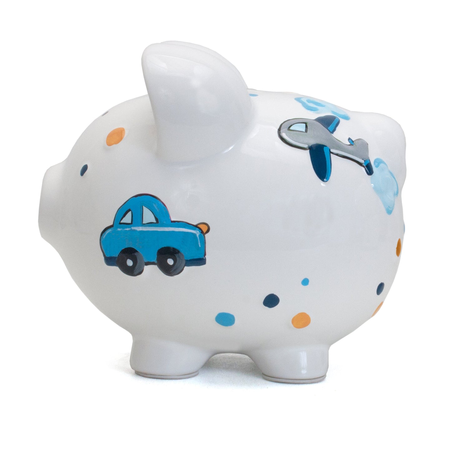 Side view of white ceramic piggy bank with handpainted blue car, silver airplane, and multicolor dots