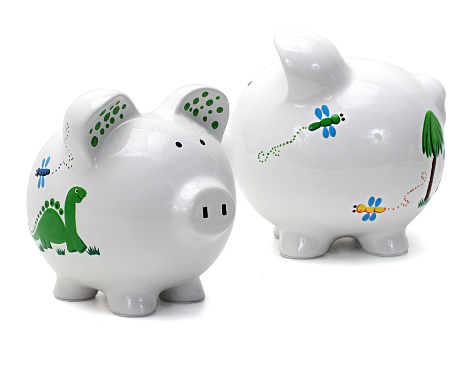 Pair of piggy banks displaying painted dinosaurs, dragonflies, and natural scenes on white ceramic