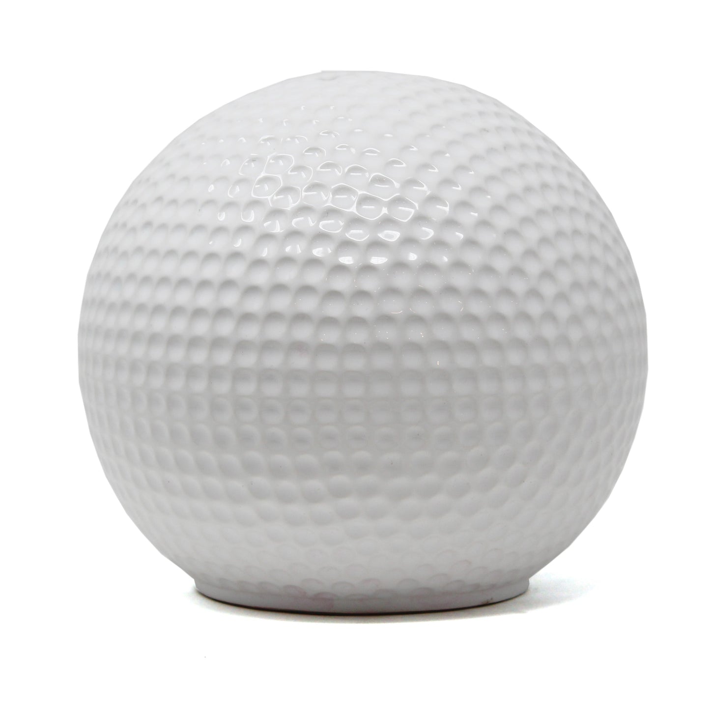 White ceramic piggy bank shaped like a golf ball with textured dimples