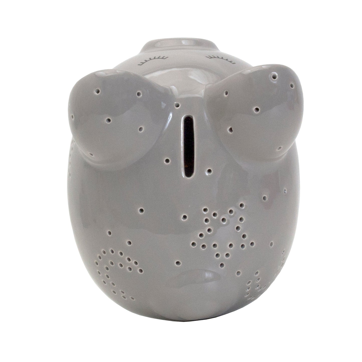 Top view of gray ceramic pig showing coin slot and star perforations