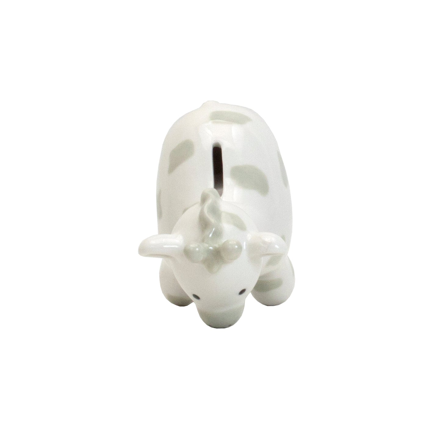 Top down angled view of the coin slot on gray spotted giraffe piggy bank