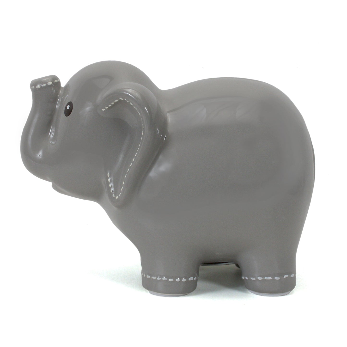 Side view of large ceramic elephant bank highlighting smooth finish and white handpainted stitching