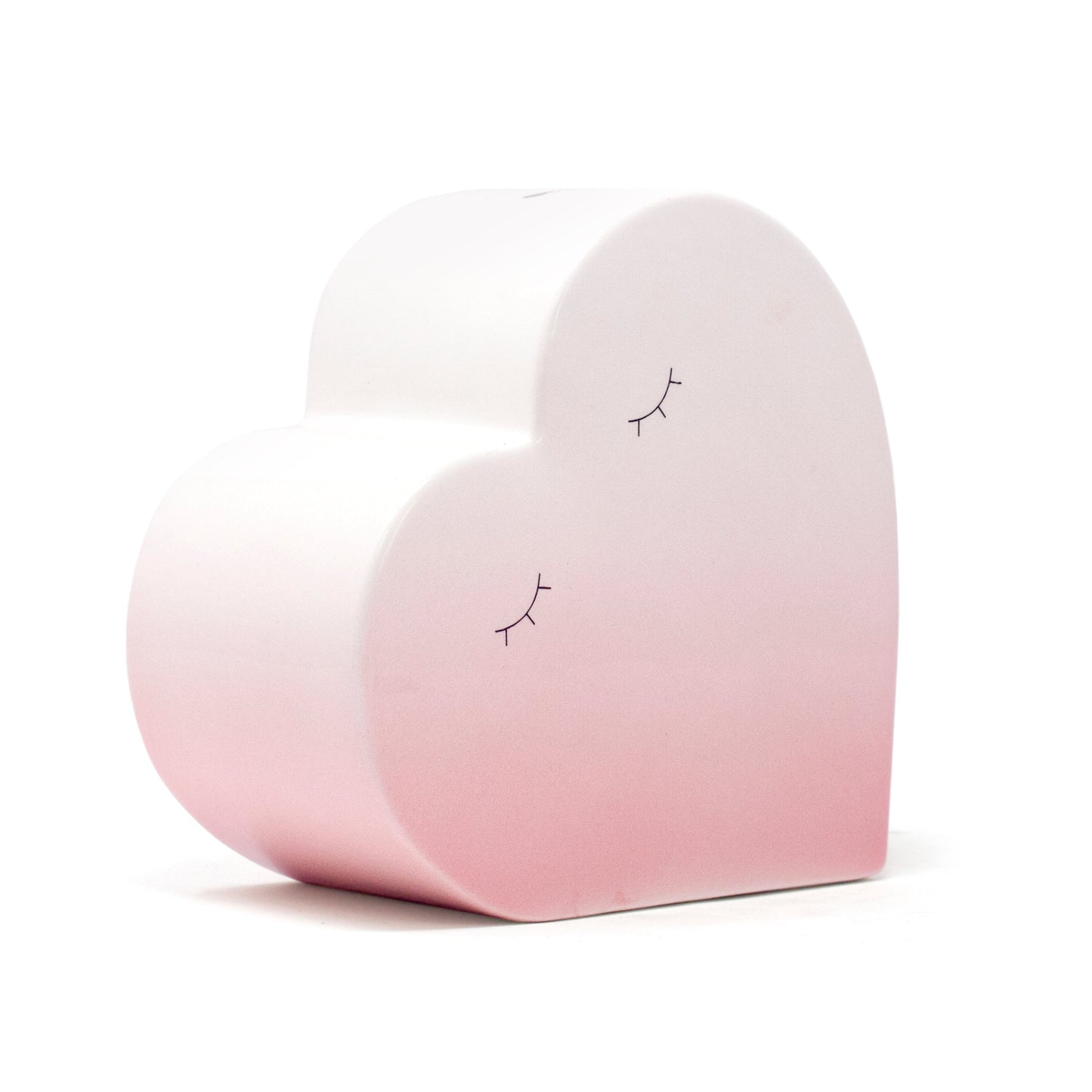 heart-shaped piggy bank with pink ombre finish and handpainted closed eye details