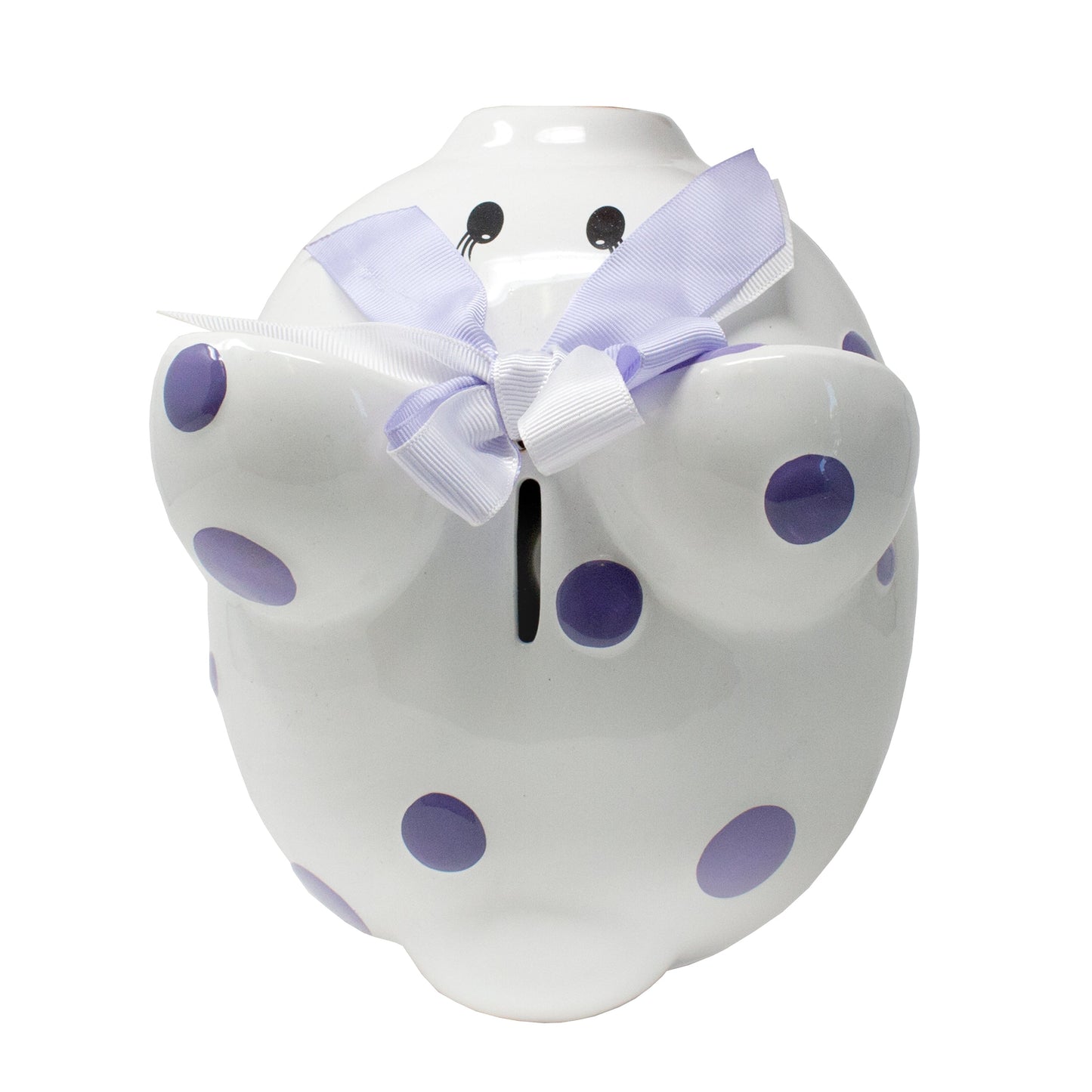 Top view of white ceramic piggy bank displaying slot and purple polka dots with bow on ear