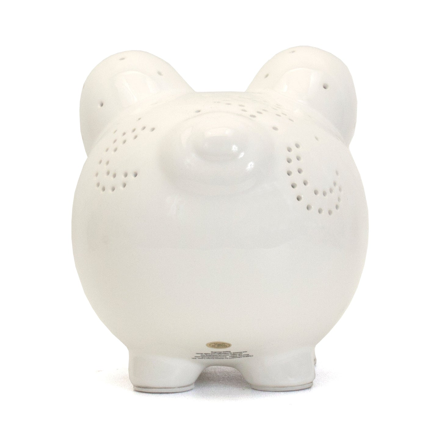Bottom view of white ceramic piggy bank with label