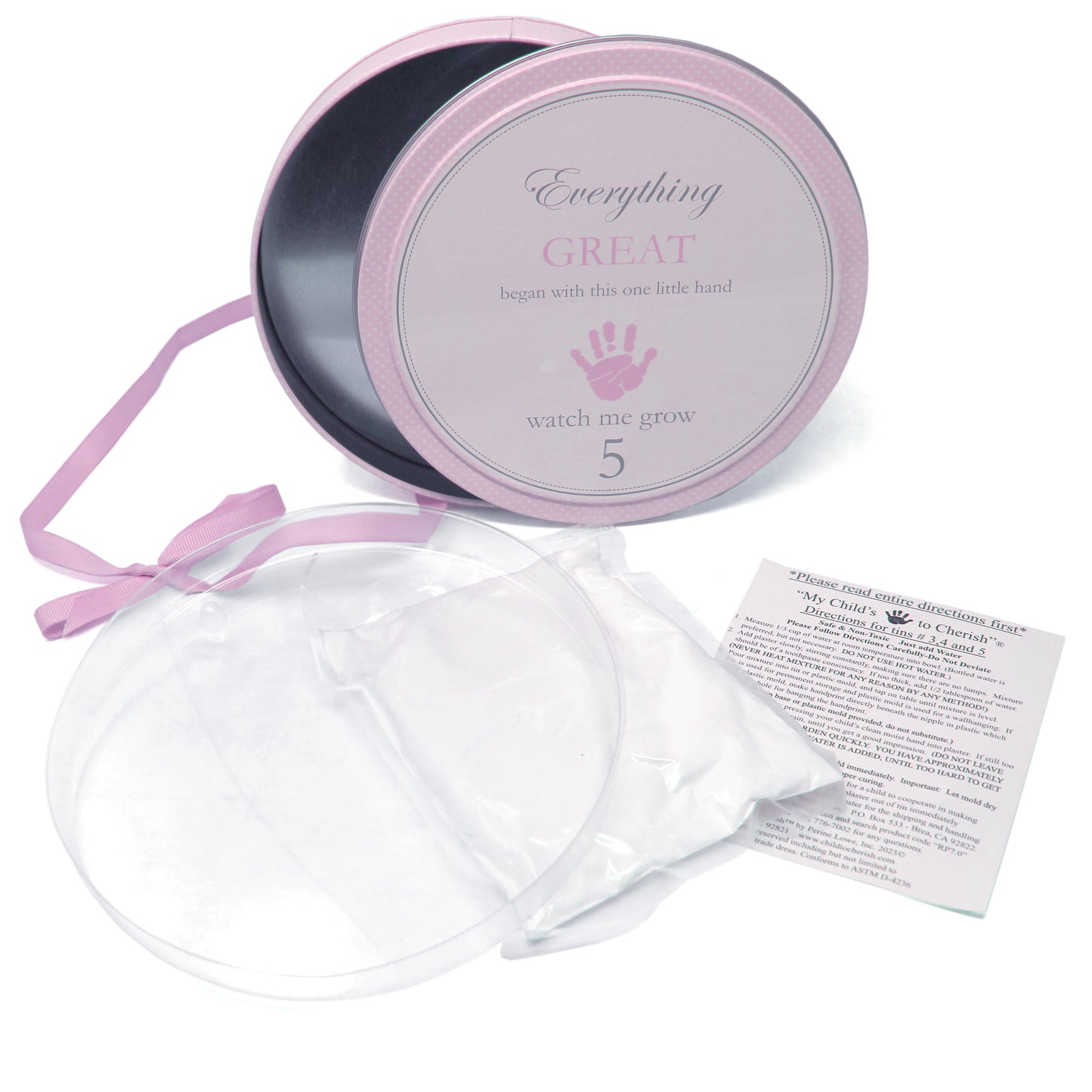 Open tin showing plaster kit materials, protective disks, and instruction sheet inside