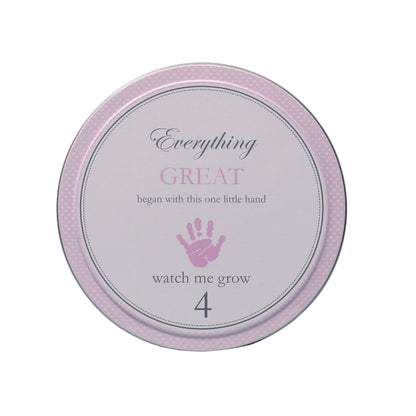 Top view of tin labeled with text 'Everything GREAT began with this one little hand 4 watch me grow'