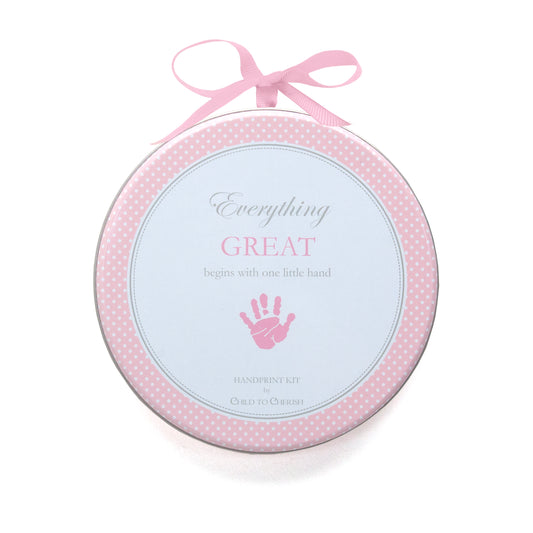 Pink handprint kit in round decorative plate with pink polka dot border and pink ribbon bow