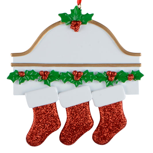 Christmas mantel ornament with three red glitter stockings and green holly leaves