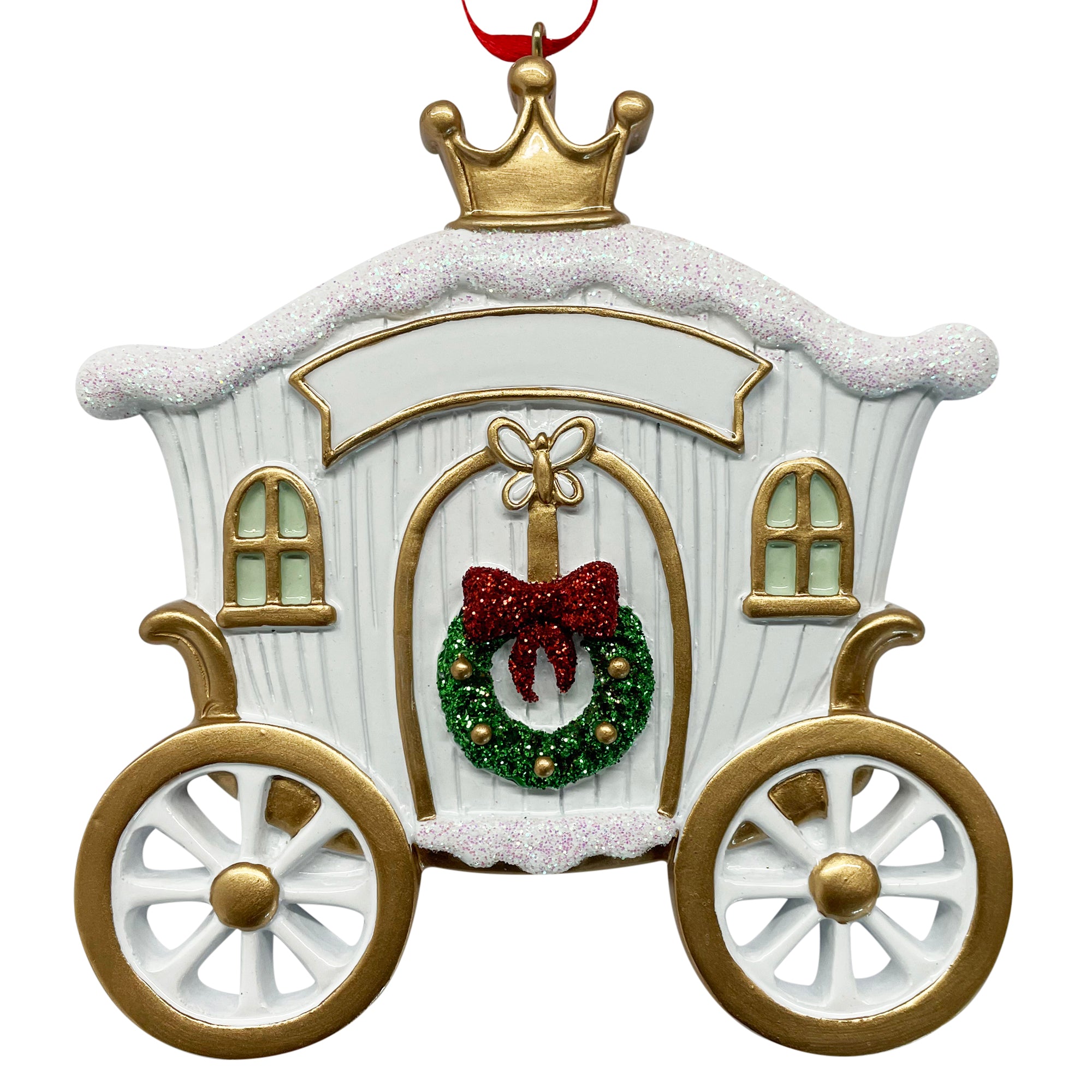 White carriage-shaped holiday ornament with gold wheels, crown, red bow wreath, and glitter accents hanging on red ribbon