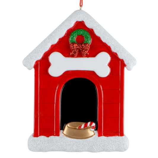 Red candy cane doghouse ornament with snow-covered roof, green wreath and red bow, white bone sign, and gold dog bowl with candy cane inside