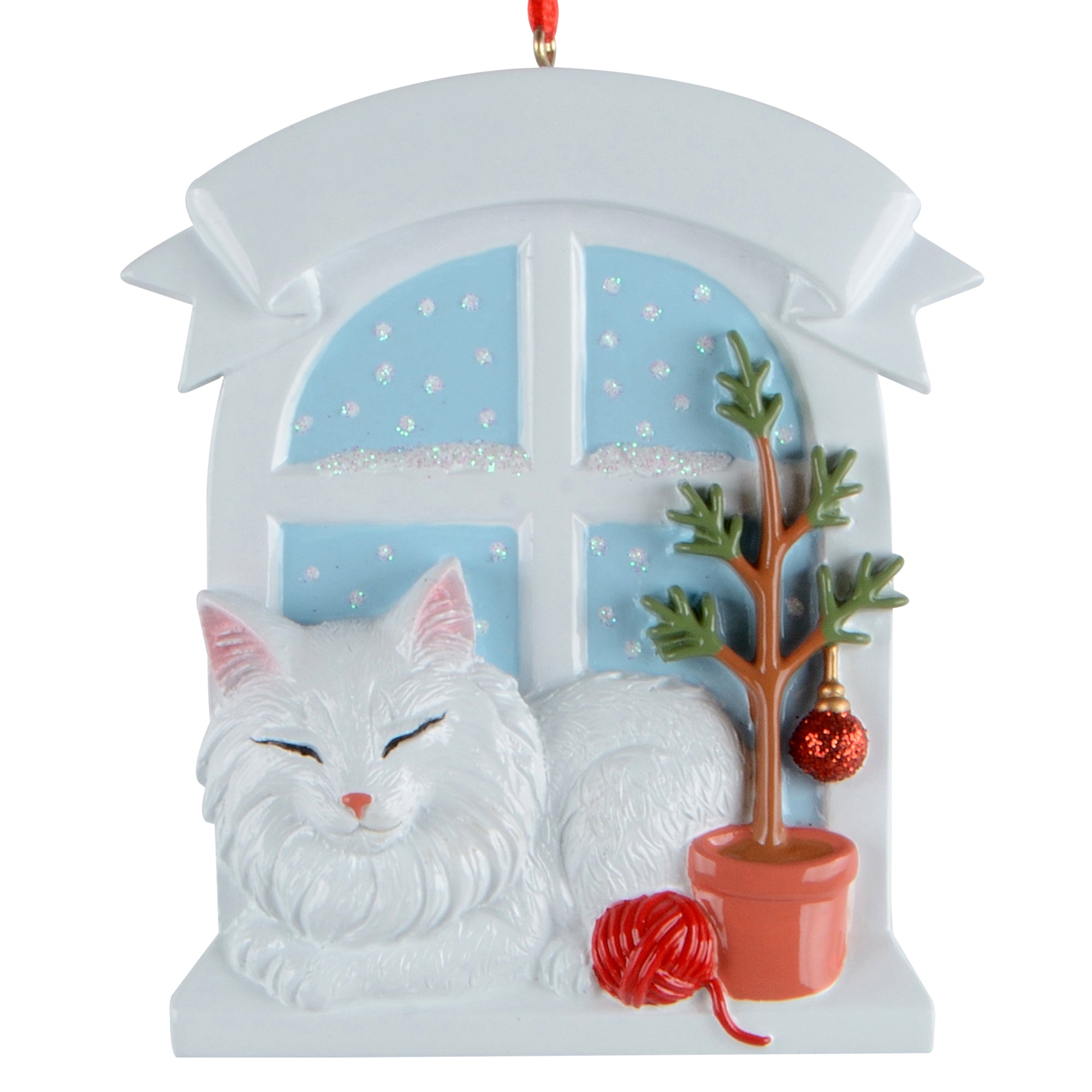 Handpainted ornament of a white Persian cat resting by window with small tree and red yarn ball