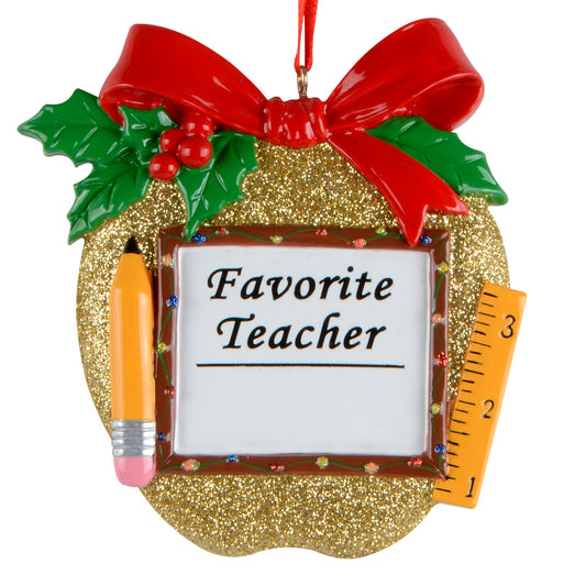 Gold apple ornament with glitter, red bow, holly leaves, pencil, ruler, and "Favorite Teacher" framed message