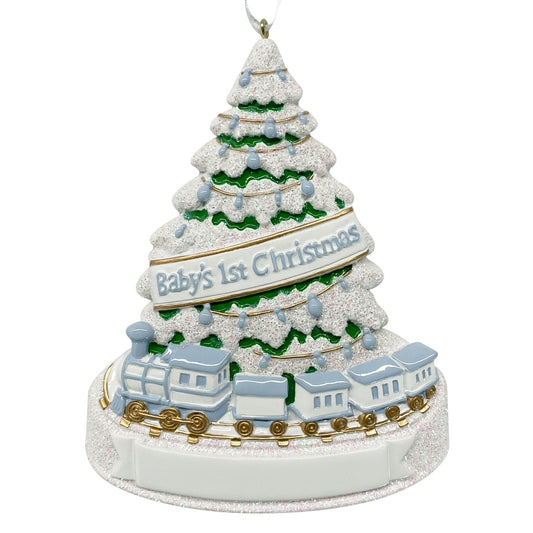 Handpainted Baby's First Christmas ornament featuring a blue and white train circling a snowy evergreen tree decorated with blue lights