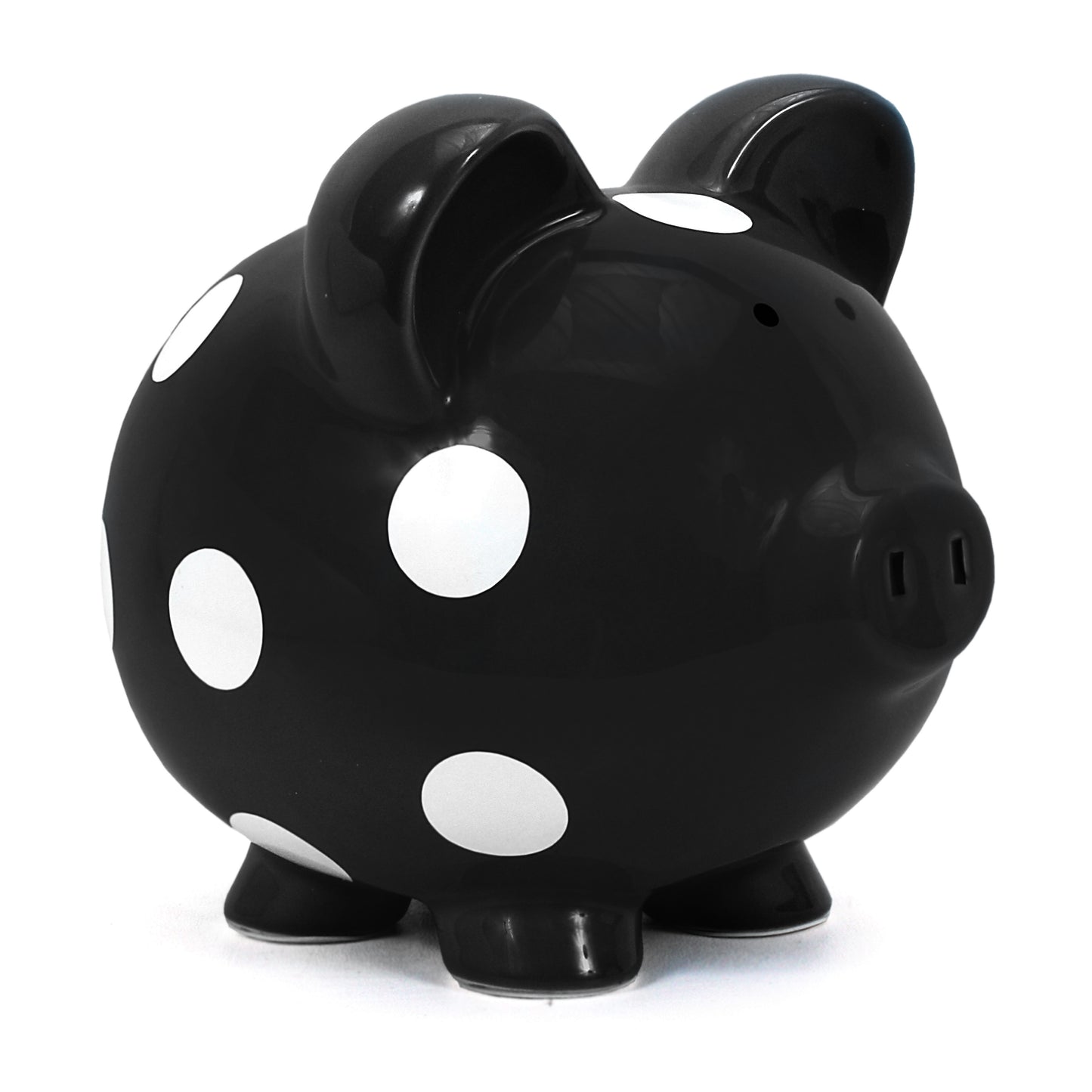 Black ceramic piggy bank with white polka dots angled left