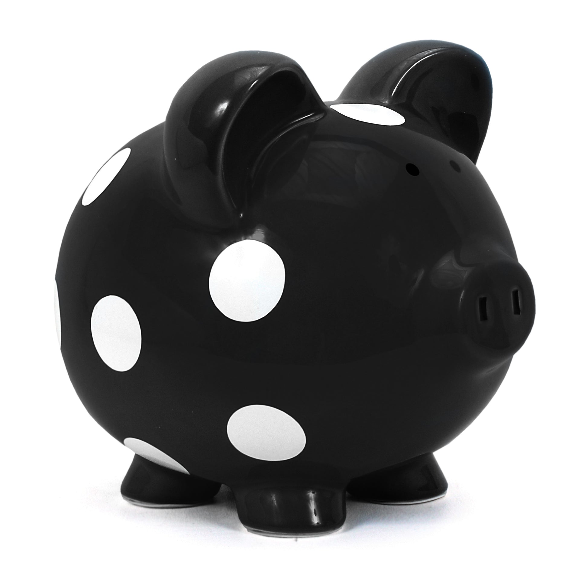 Black ceramic piggy bank with white polka dots angled left
