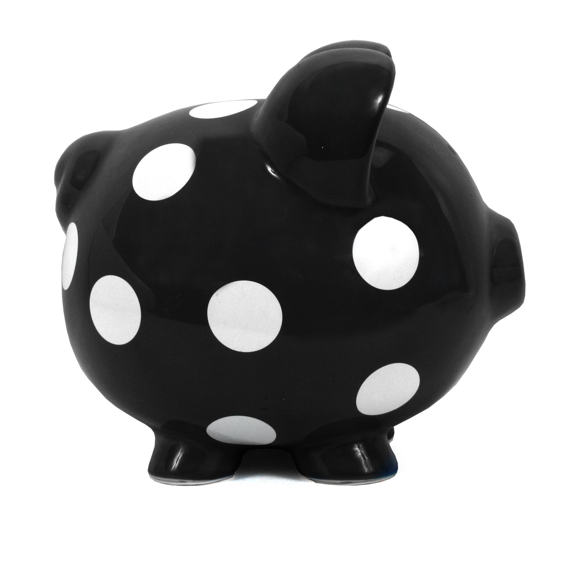 Side view of black polka dot piggy bank showing rounded shape
