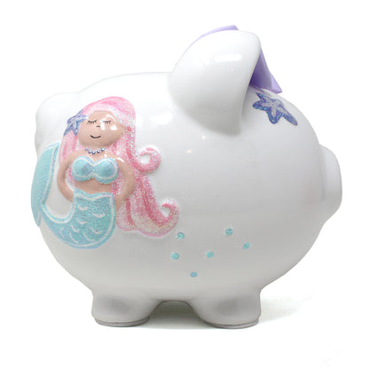 White ceramic piggy bank with pink-haired glittery mermaid design on side