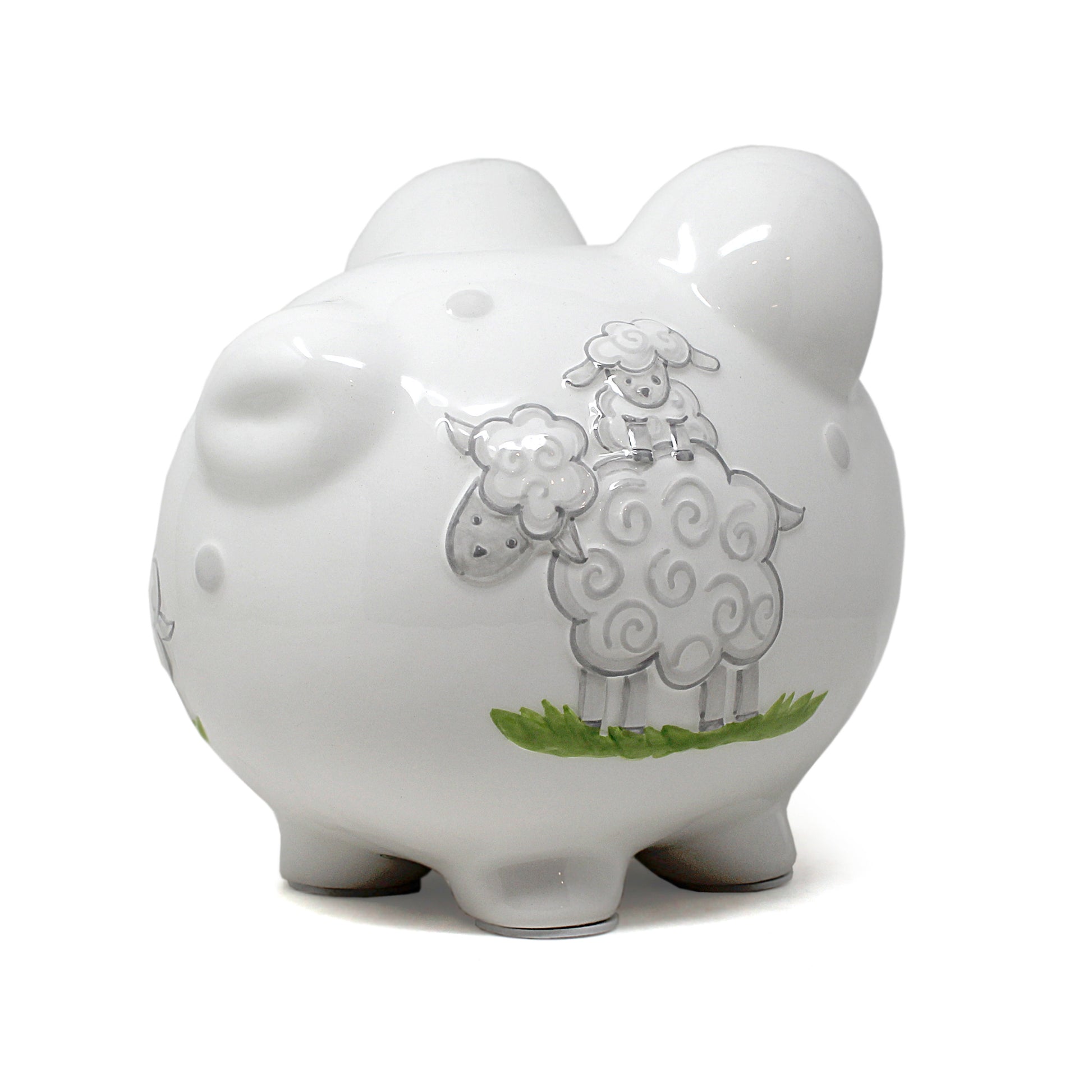 Close-up of glazed piggy bank with handpainted lamb design on side