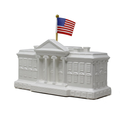 Angled left side view of White House porcelain bank with details of windows and columns