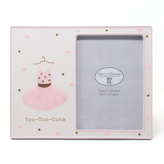 Ceramic picture frame with pink ballerina dress illustration and gold and pink polka dots holding a 4x6 photo
