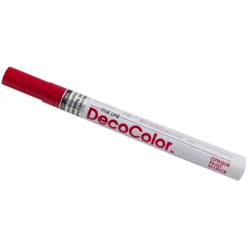 Close-up of a Crimson Lake DecoColor fine tip paint pen with red cap and white barrel