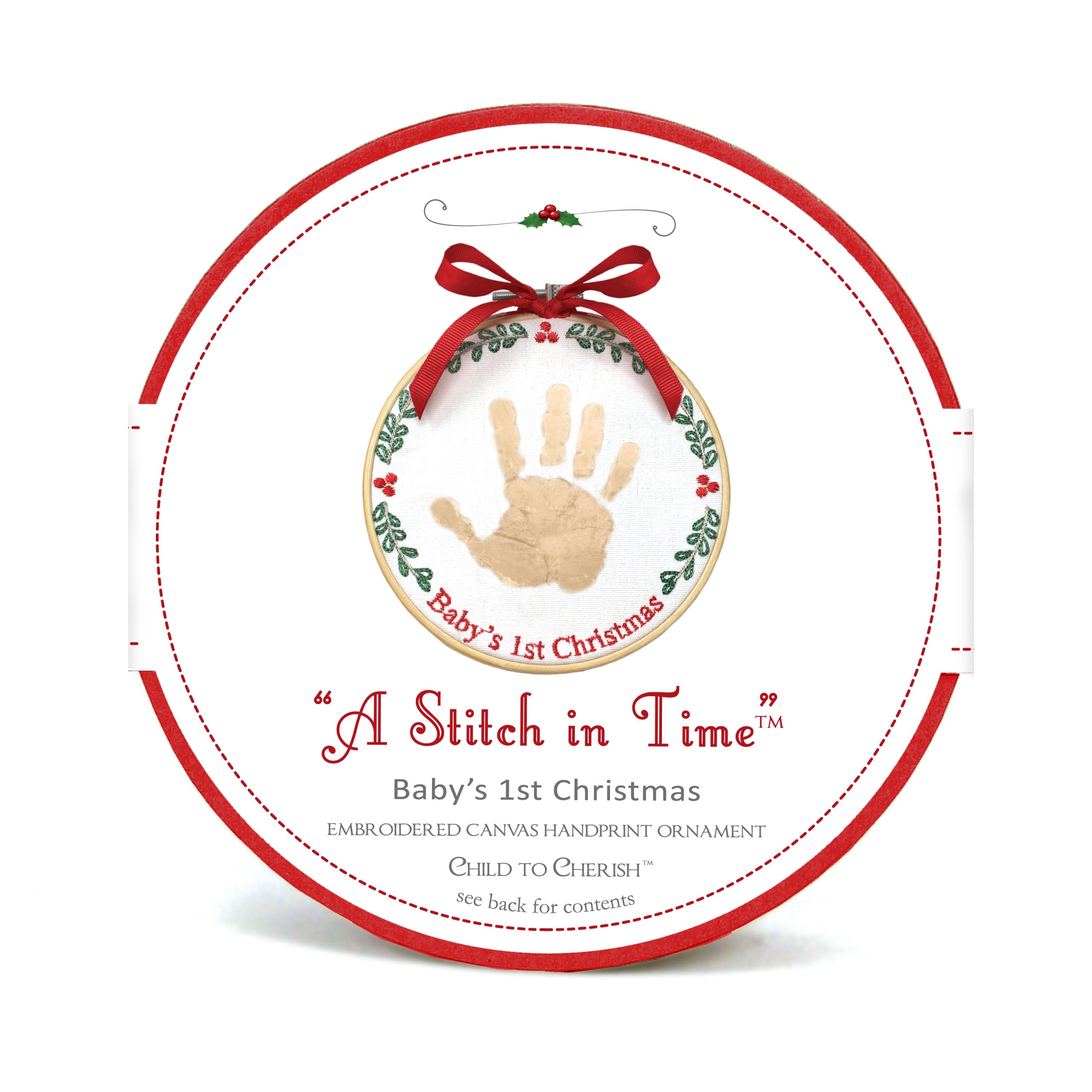 Packaging of A Stitch in Time Baby's 1st Christmas handprint ornament showing wood hoop and embroidered canvas with gold handprint and red ribbon