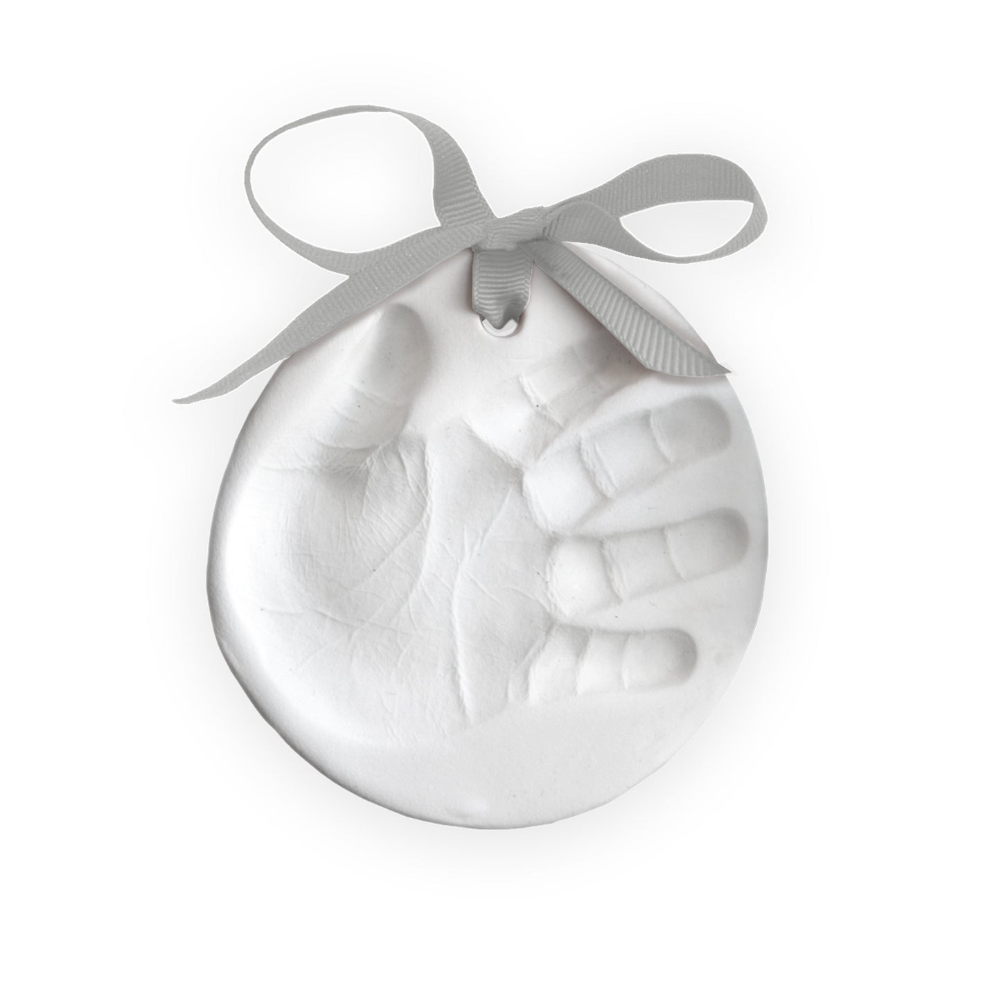 Close-up of a finished white clay handprint ornament with a gray ribbon tied at the top