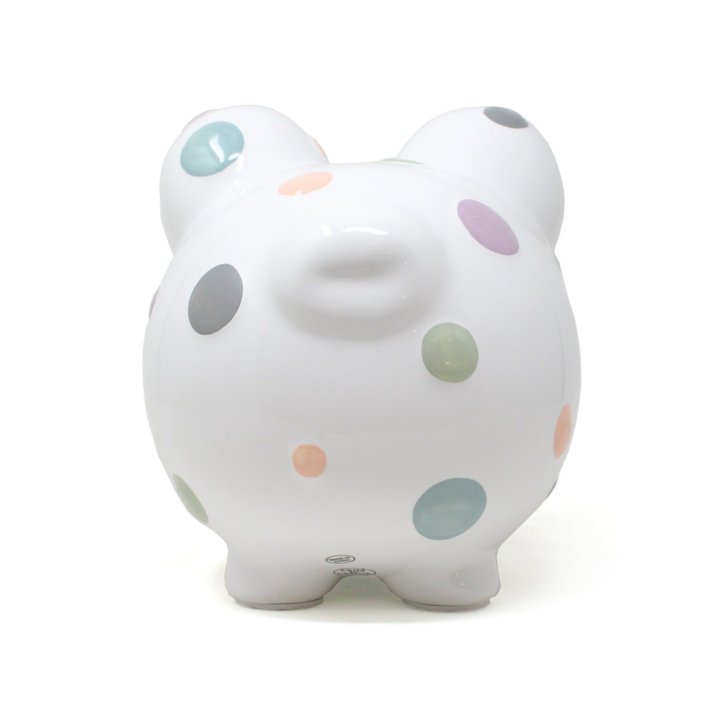 Piggy bank placed on a shelf surrounded by decorative items