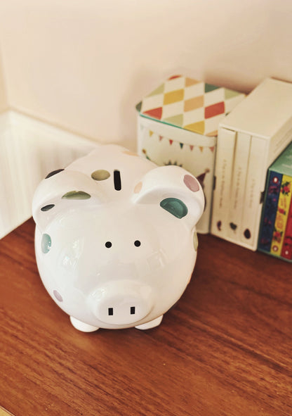 Top angled view showing coin slot on back beside wooden toys