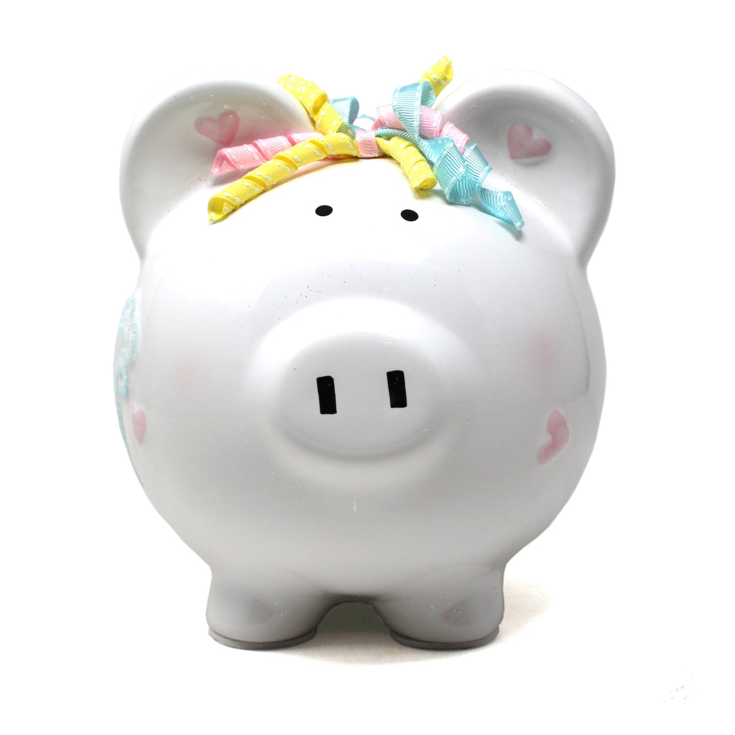 Front view of piggy bank with black coin slot on top and pink hearts on ears