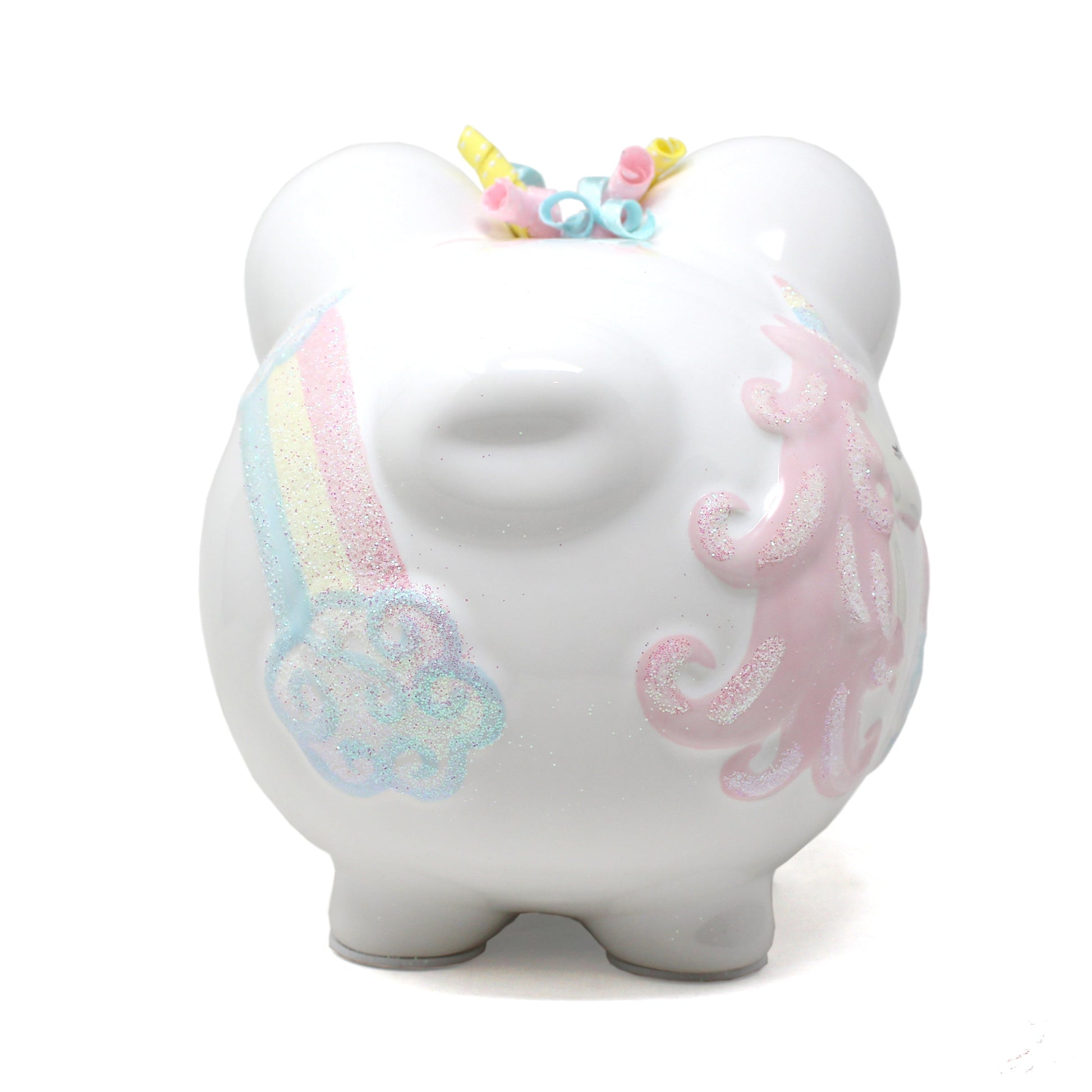 Side profile showing curled pastel ribbons on ears and glitter heart details on piggy bank