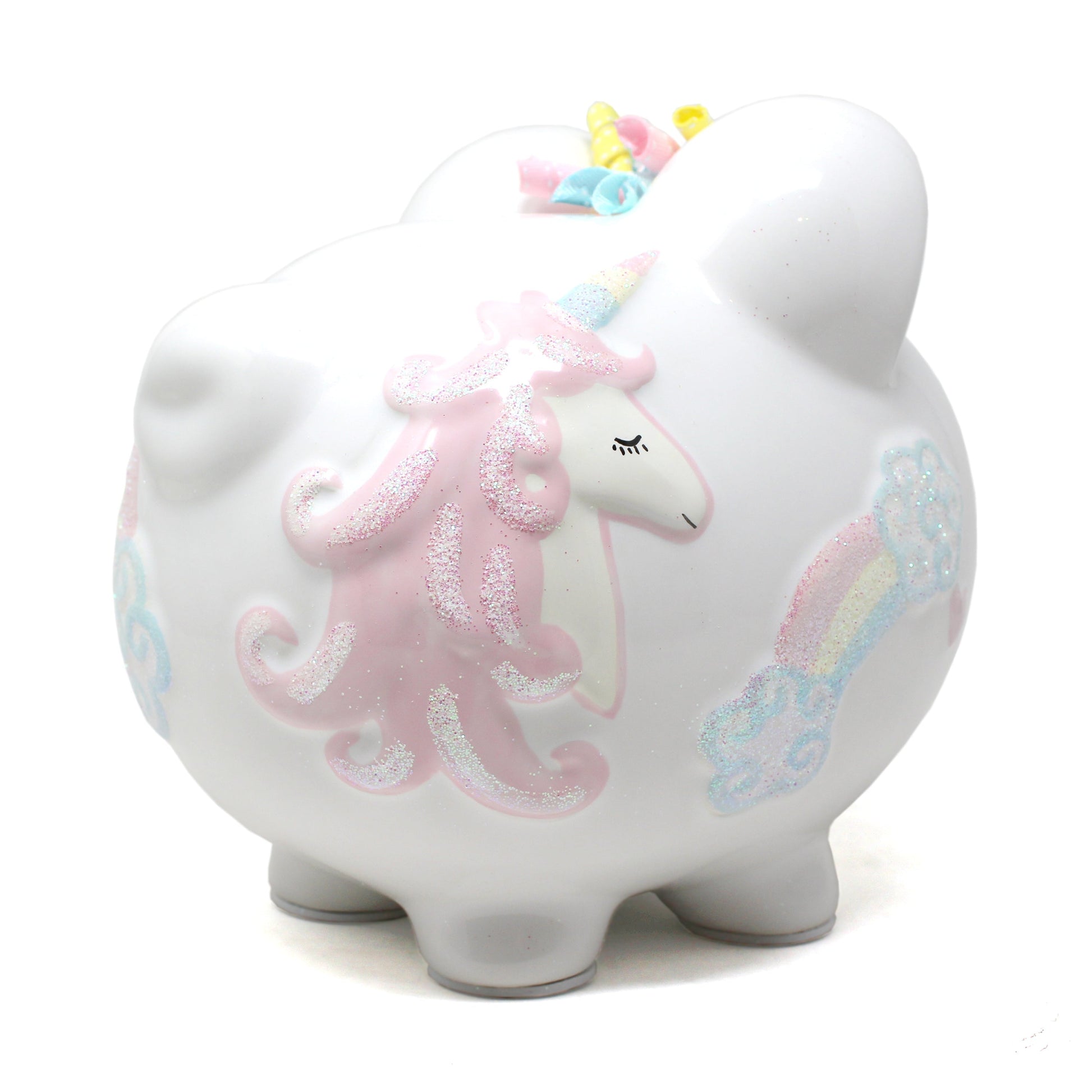 Overall view of glossy white unicorn piggy bank decorated with rainbows and hearts