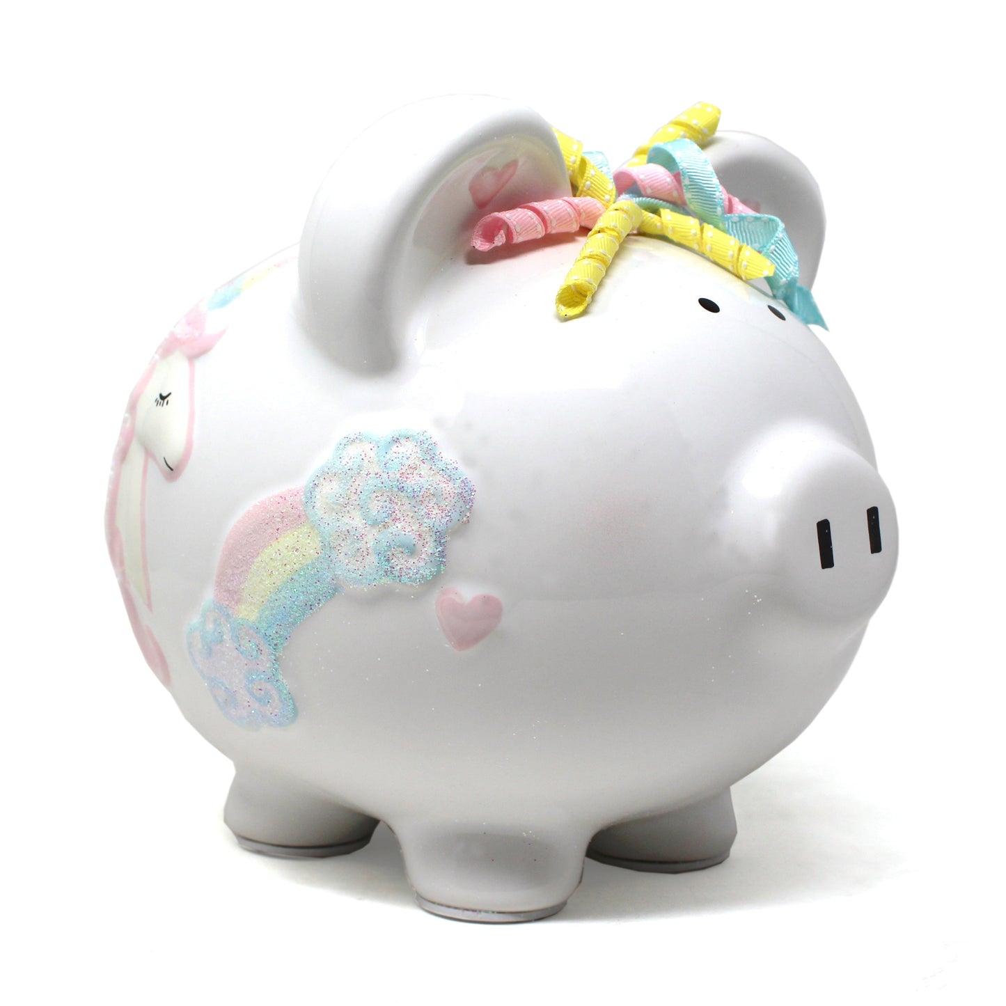Side view of white ceramic unicorn piggy bank with handpainted pastel rainbow and glitter clouds