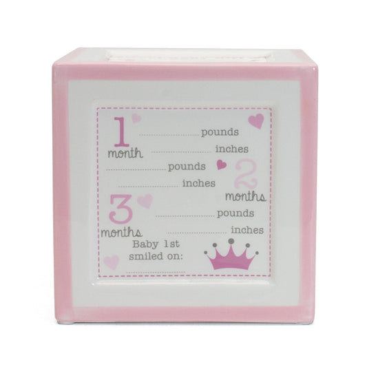 Pink ceramic milestone block with spaces to record baby's weight, height, and first smile at 1, 2, and 3 months