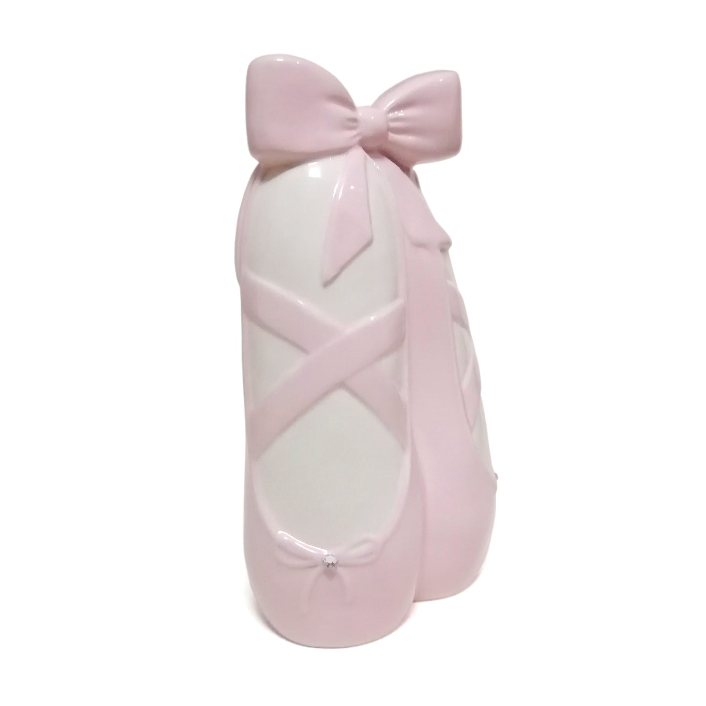 Ceramic ballerina slippers piggy bank in soft pink with decorative bows and crossed straps
