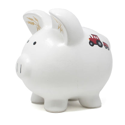 Opposite side view of piggy bank showing large red barn and farm animals