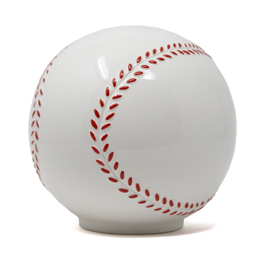 Glossy white ceramic piggy bank shaped like a baseball with raised red stitching detail