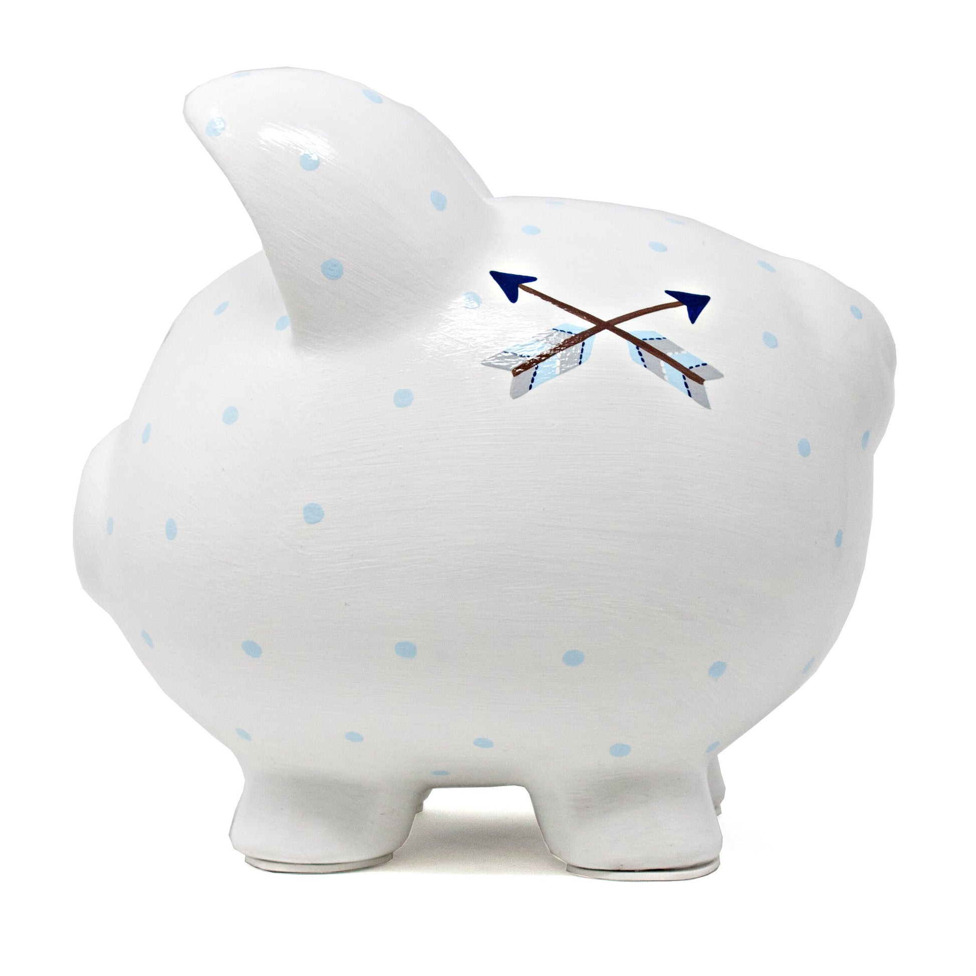 Top view of white ceramic piggy bank showing coin slot and blue polka dot details with crossed arrows