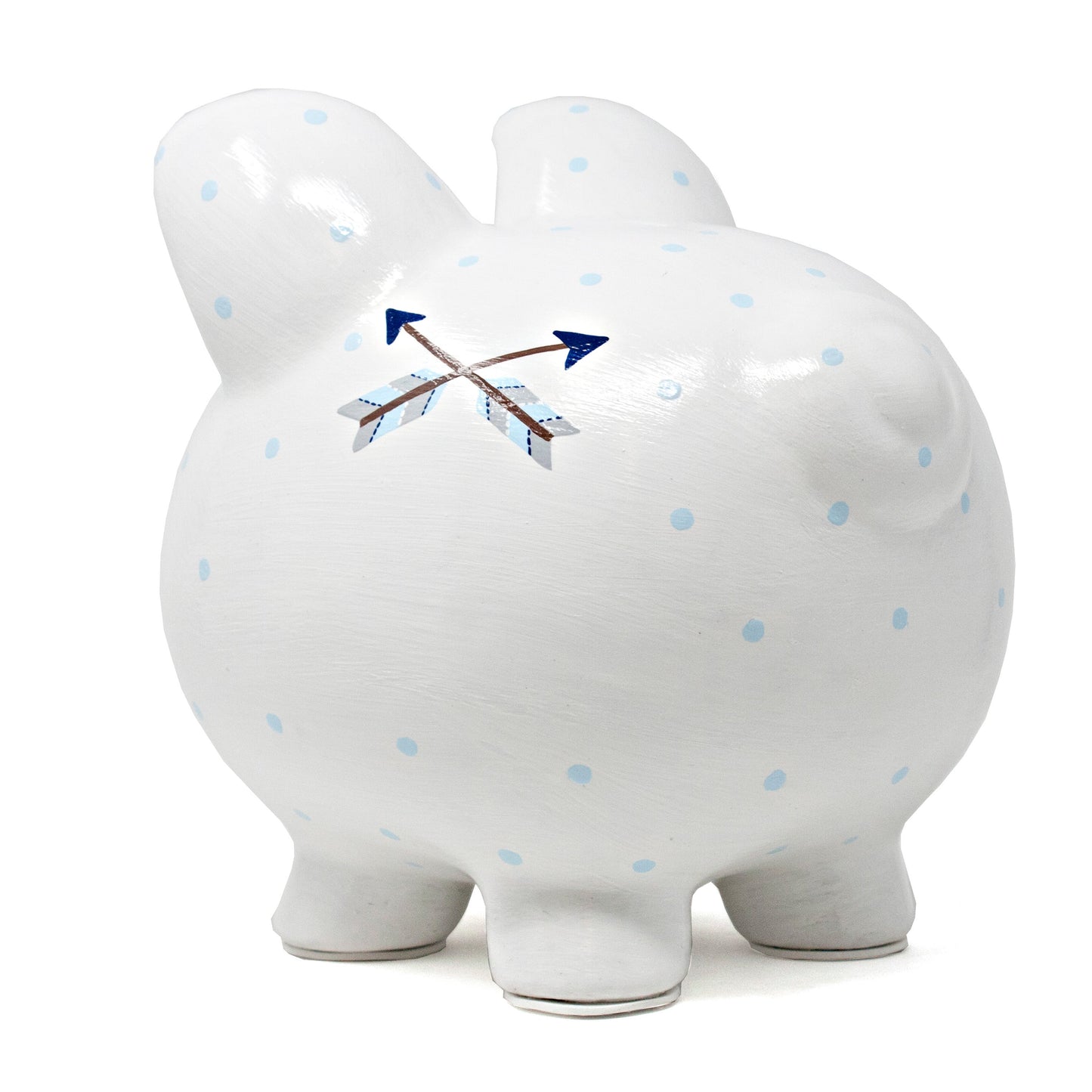 Back side profile of white ceramic piggy bank with light blue polka dots and crossed arrow painted detail