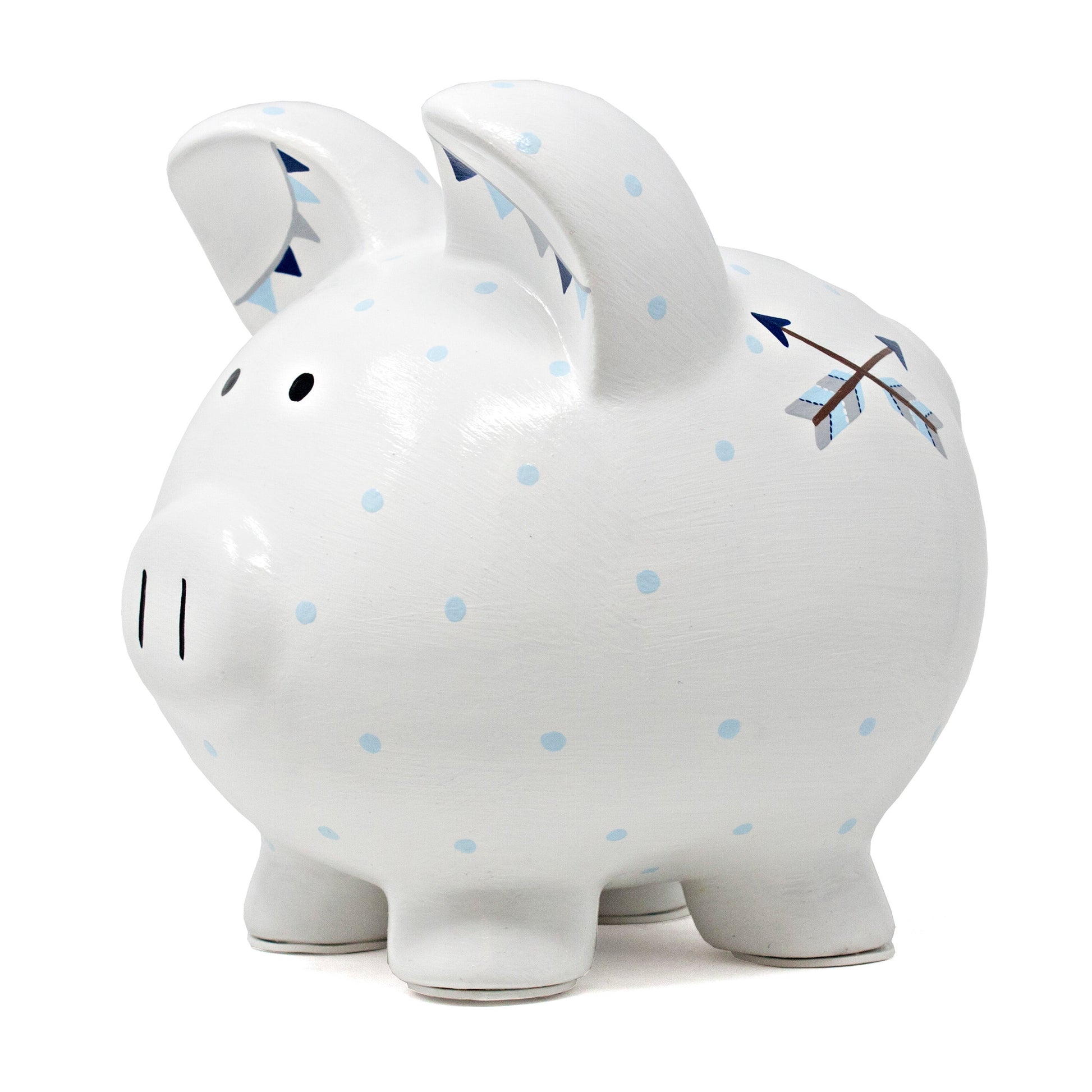 Close-up of piggy bank back side showing blue polka dots and two crossed arrows handpainted