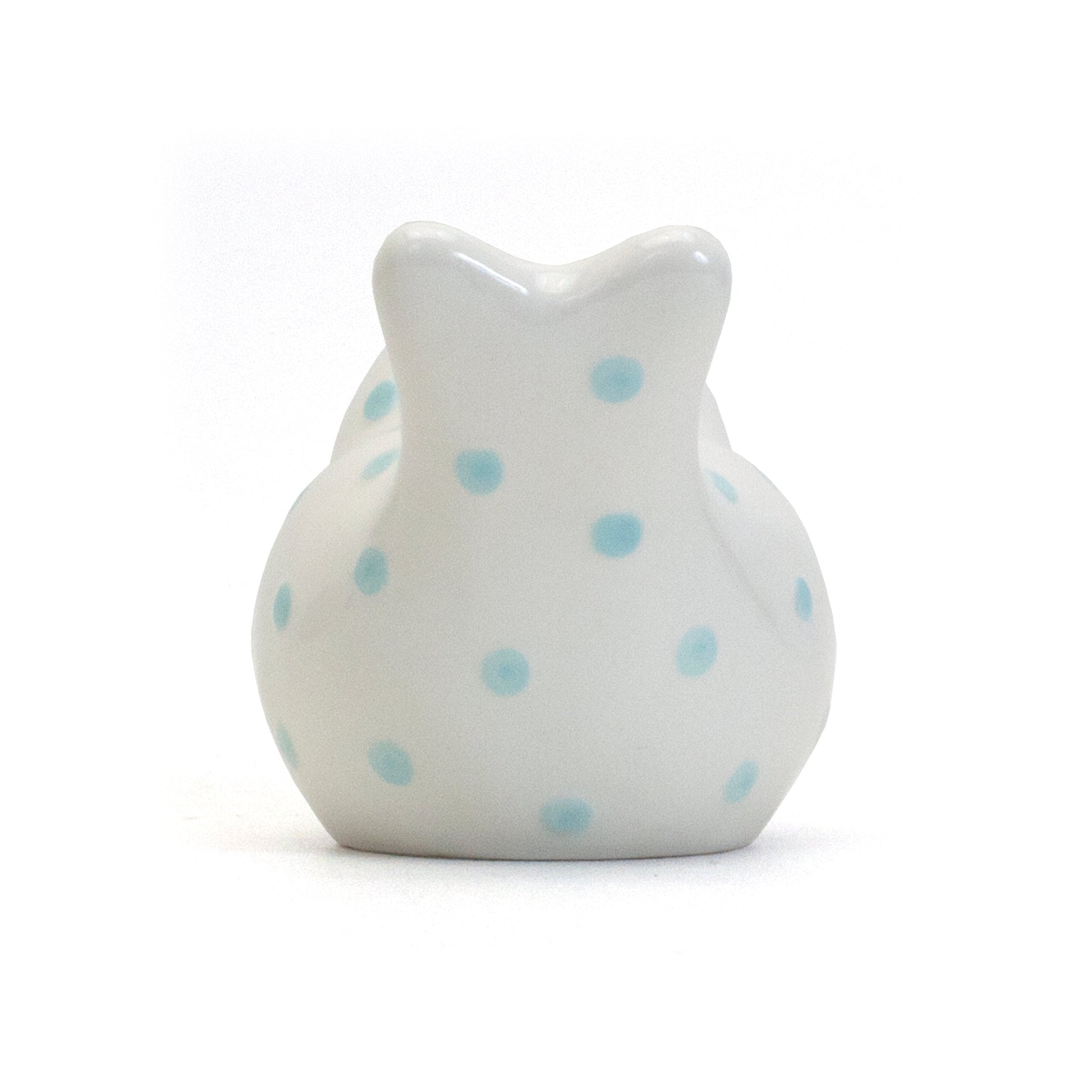 Back view of blue polka dot white ceramic bird bank showing tail and rounded shape