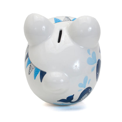 Top-down angled view of piggy bank highlighting whale design and gloss finish