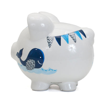 Full side angle showing smiling blue whale on white ceramic piggy bank