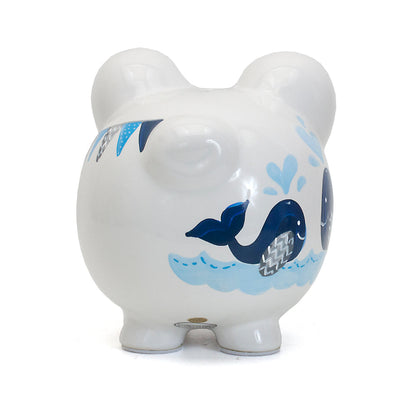 Rear view showing two painted whales facing each other on piggy bank