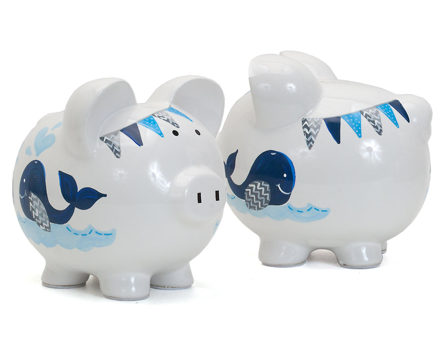 Pair of handpainted whale piggy banks shown side by side