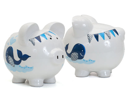 Pair of handpainted whale piggy banks shown side by side