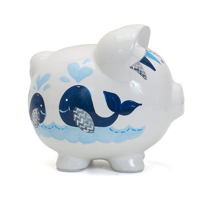 Right side view showing blue whales and water splash artwork on piggy bank