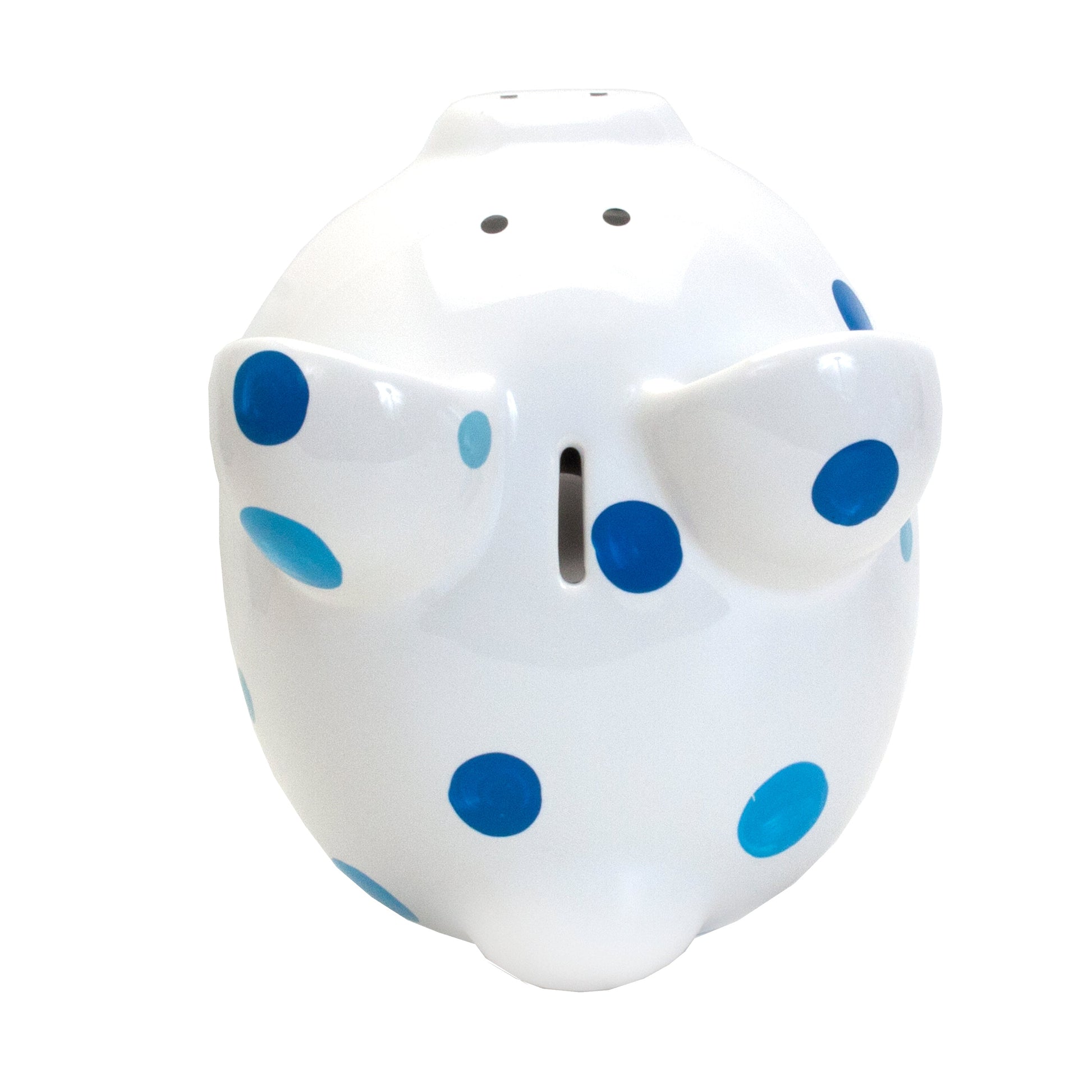 Top view showing coin slot on white piggy bank with blue polka dots